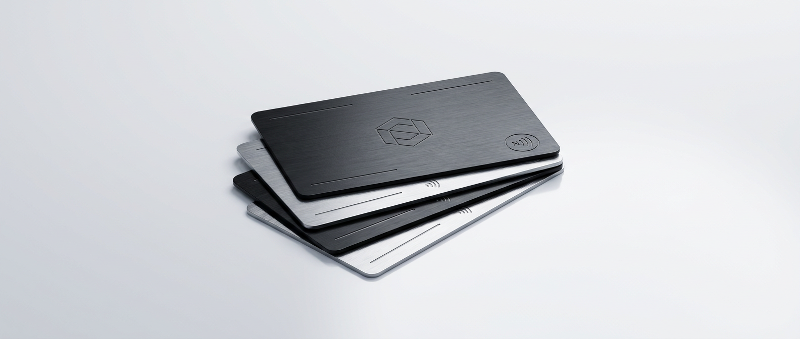 Premium metal and NFC smart business cards on a clean studio background