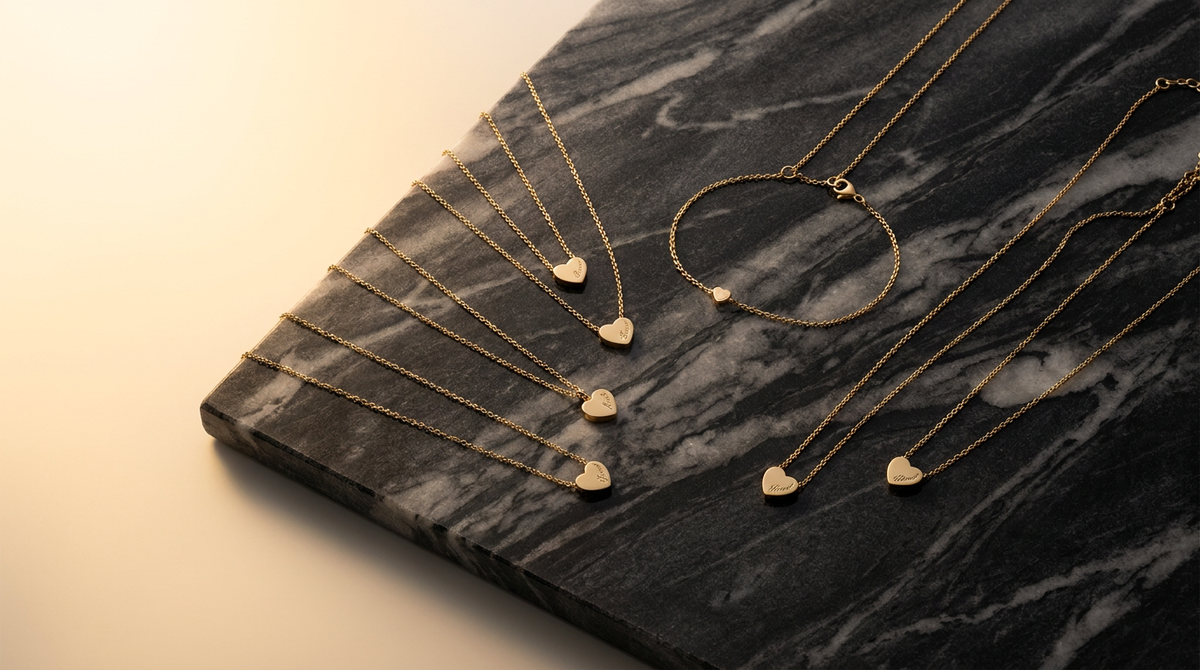 Engraved gold jewelry on marble