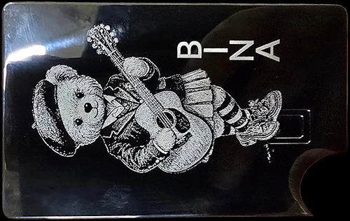 Bear with guitar on metal credit card — BINA