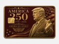 Burgundy and gold commemorative metal credit card with a patriotic profile portrait, shield emblem, stars, and American Spirit lettering